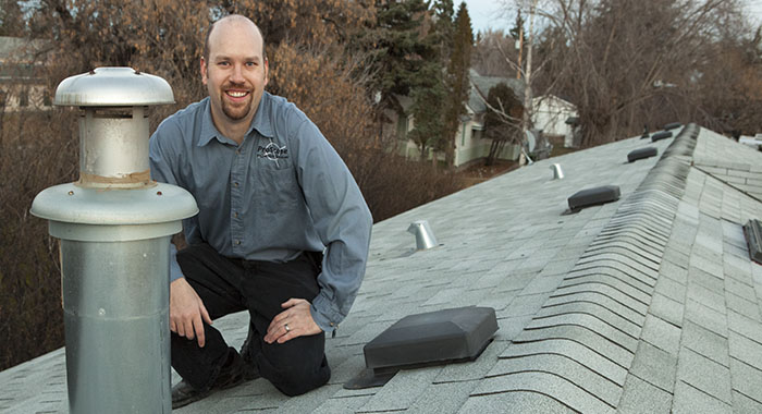 home inspector on a roof in Stettler